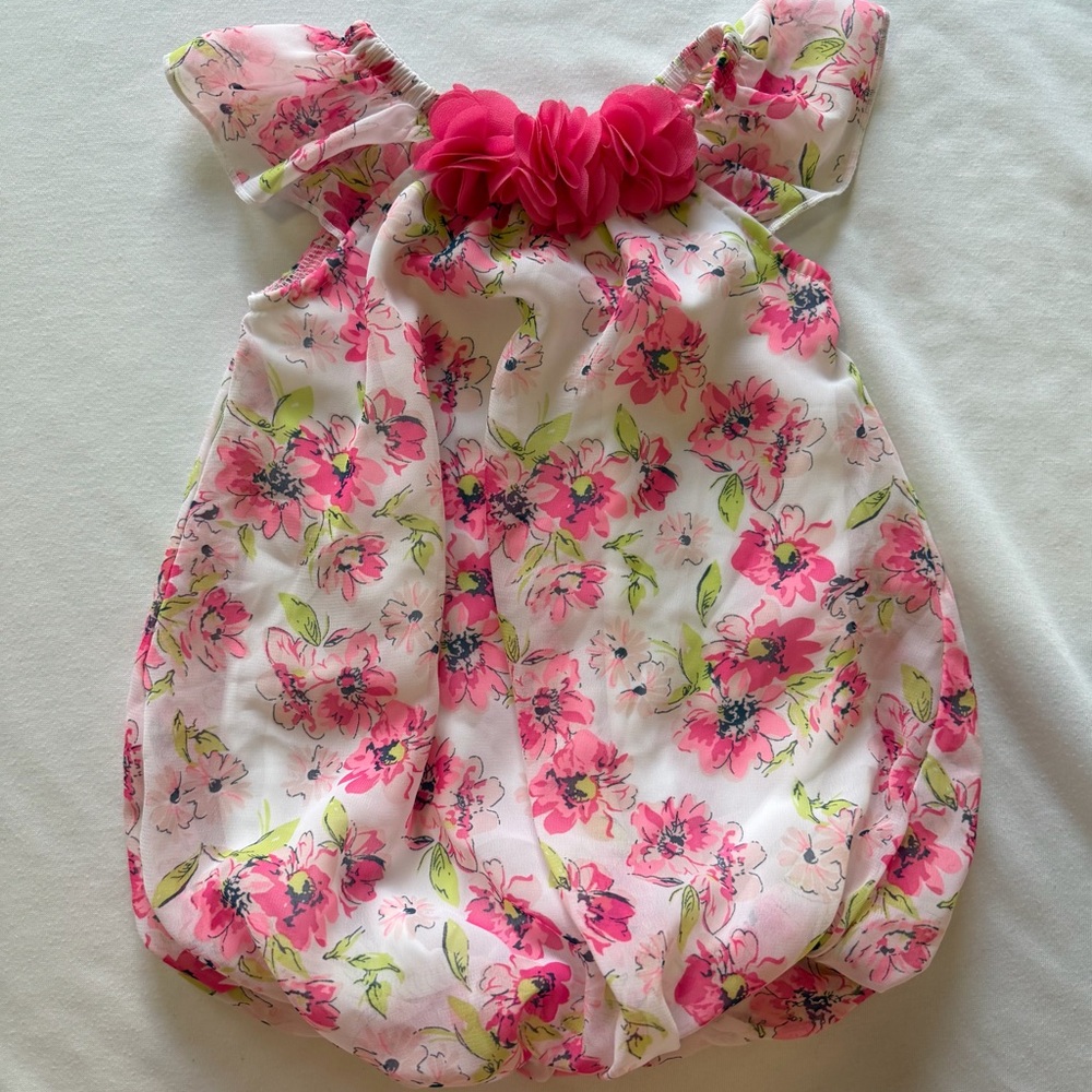 Adorable baby girl one piece snap crotch outfit.